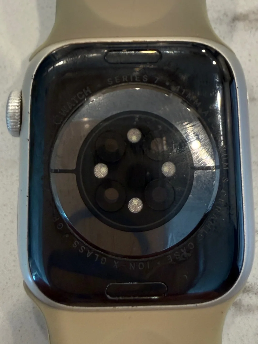 Apple Watch Series 7, 41mm with neutral Sport Band and Silver Aluminum Case